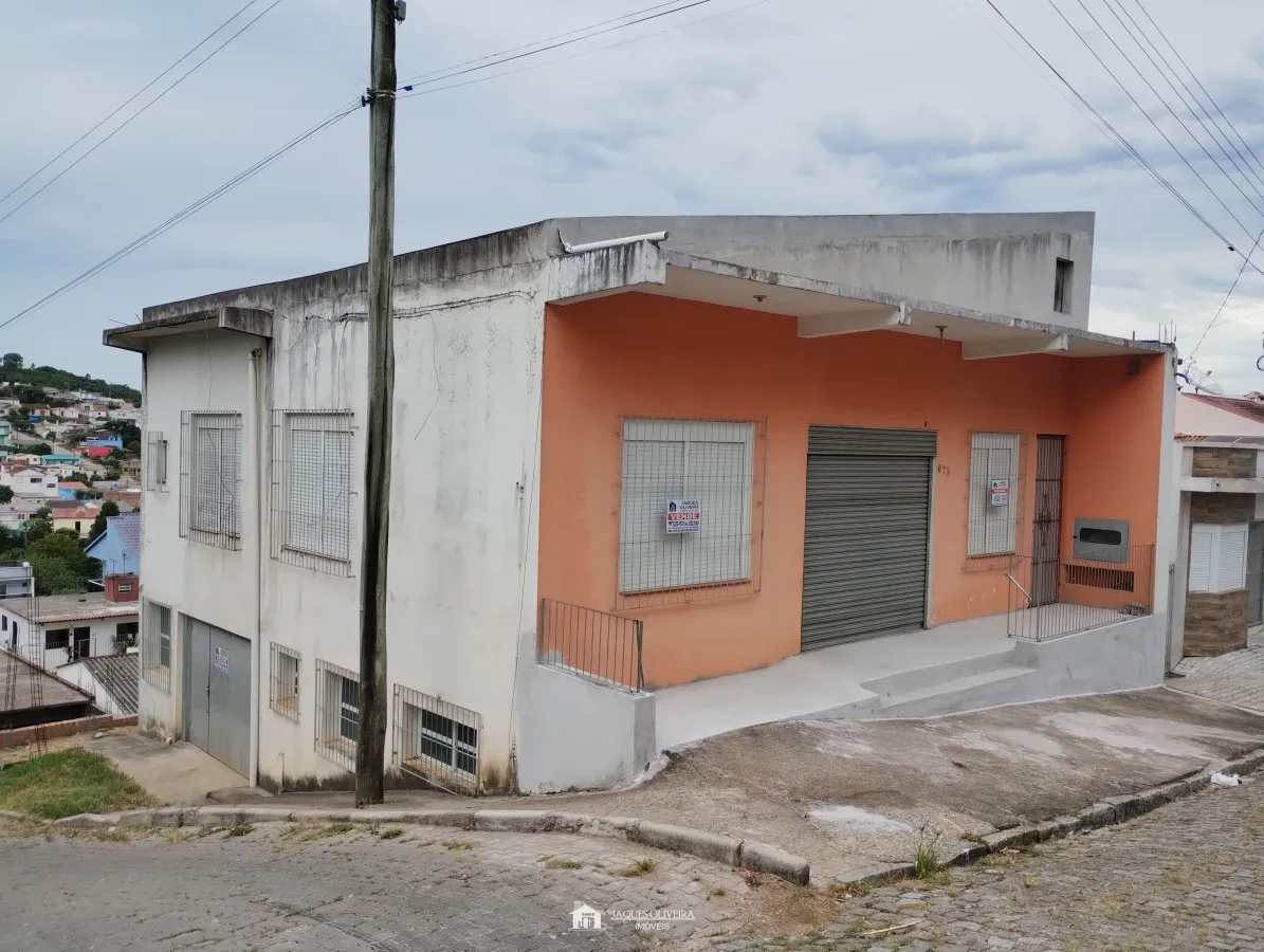 Imagem de Salão comercial com garagens.