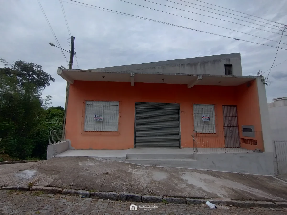 Imagem de Salão comercial com garagens.