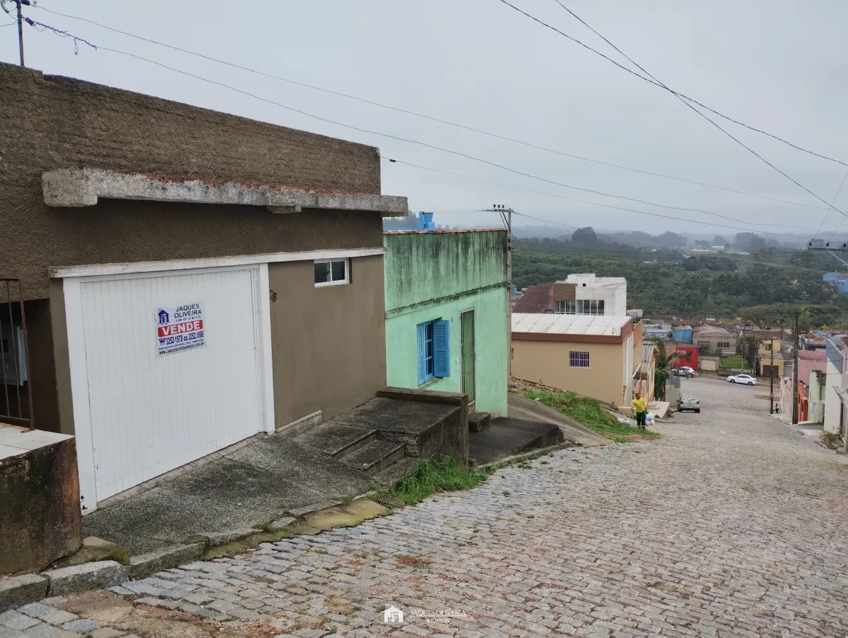 Imagem de Casa 03 dormitórios, garagem no bairro Triângulo.