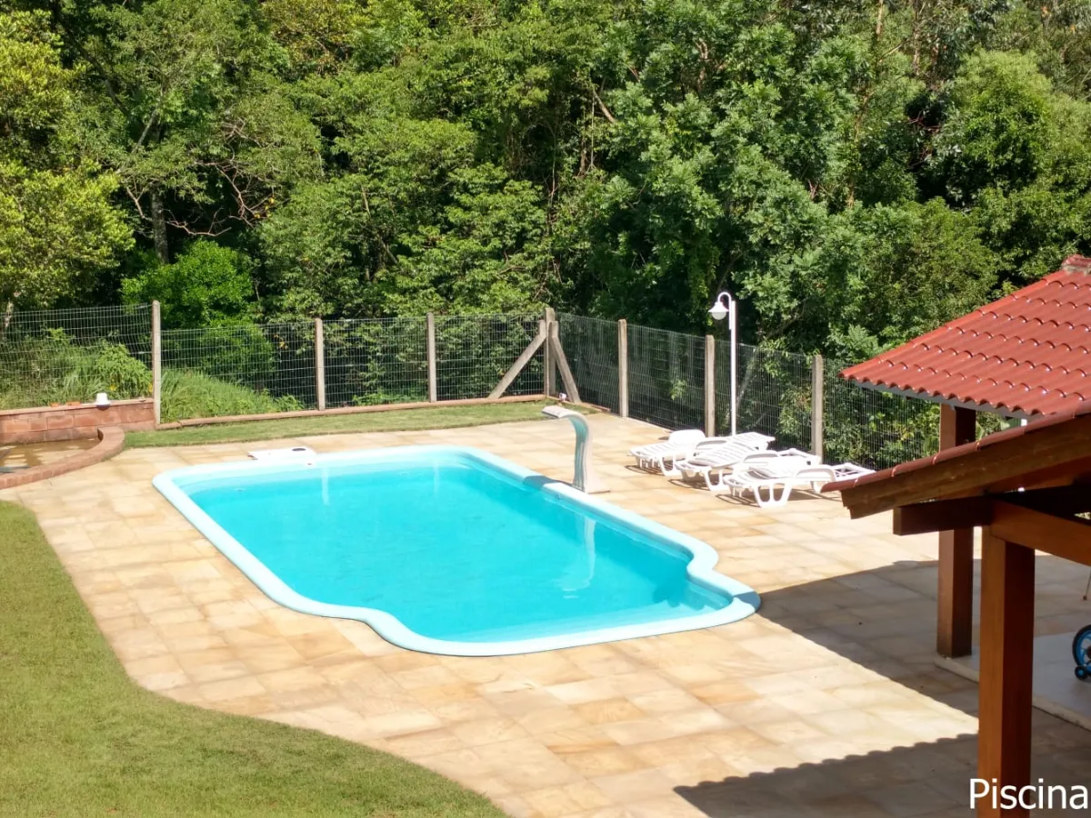 Imagem de Refúgio exclusivo com alto padrão e muito verde em Taquara/RS. Residência encantadora com piscina e espaço gourmet.