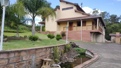 Imagem de Refúgio exclusivo com alto padrão e muito verde em Taquara/RS. Residência encantadora com piscina e espaço gourmet.