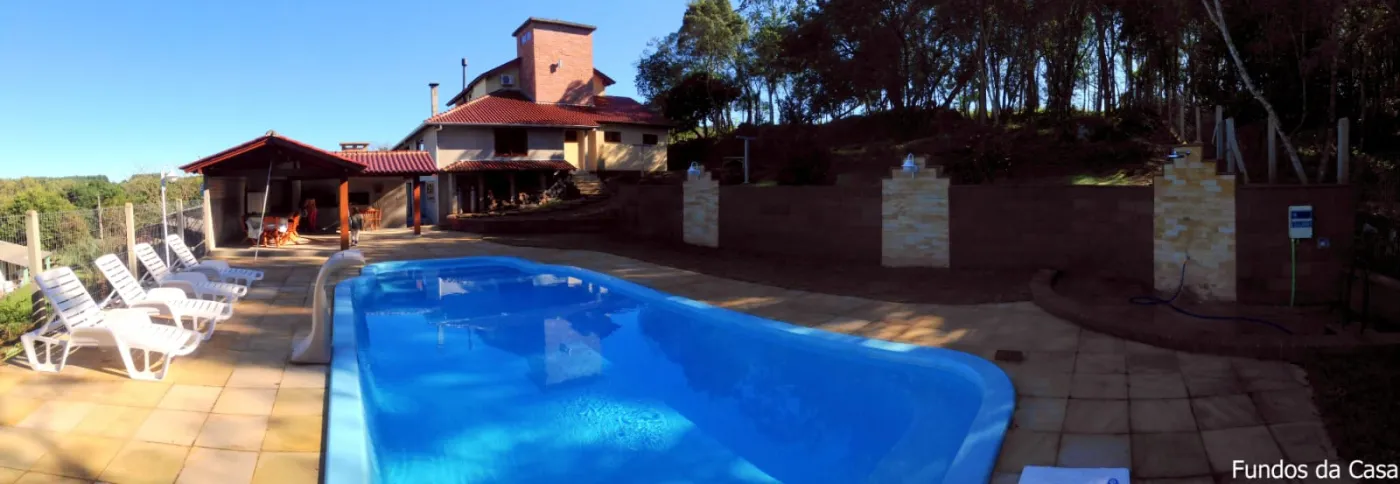 Imagem de Refúgio exclusivo com alto padrão e muito verde em Taquara/RS. Residência encantadora com piscina e espaço gourmet.