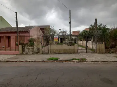 Imagem de Terreno com uma casa de alvenaria nos fundos bairro sarandi Porto Alegre