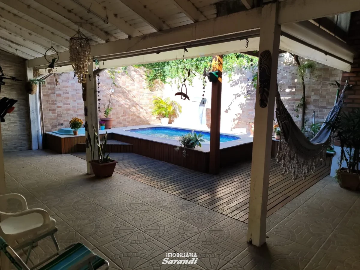 Imagem de Casa três dormitórios uma suíte, pergolado com piscina bairro sarandi Porto Alegre