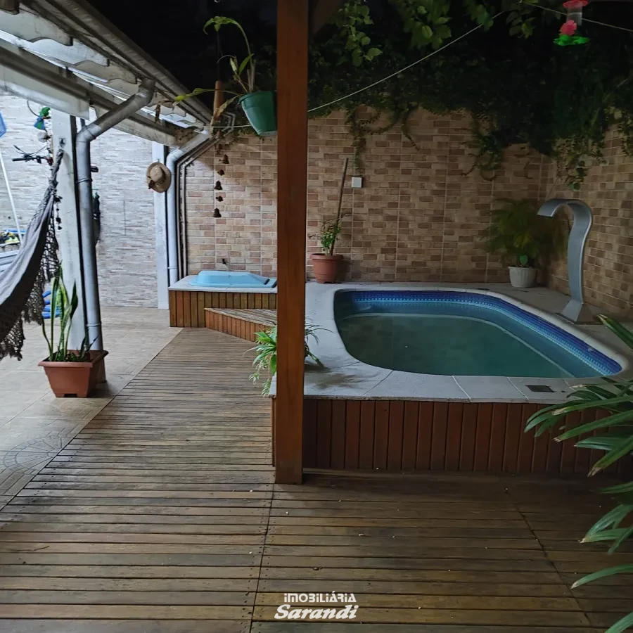 Imagem de Casa três dormitórios uma suíte, pergolado com piscina bairro sarandi Porto Alegre