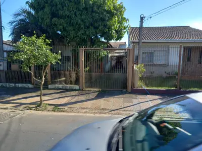 Imagem de Casa de alvenaria na frente com três dormitórios área de  77,00m² e outra nos fundos dois dormitórios área de 60,00m² bairro sarandi Porto Alegre