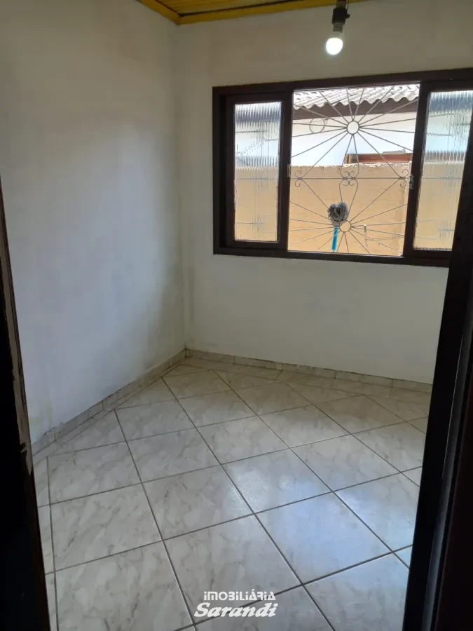 Imagem de Casa de alvenaria de esquina Jardim Ingá três dormitórios um com suíte Porto Alegre