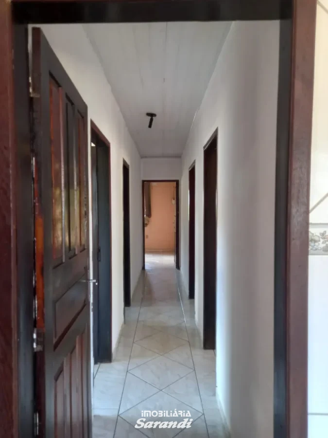 Imagem de Casa de alvenaria de esquina Jardim Ingá três dormitórios um com suíte Porto Alegre