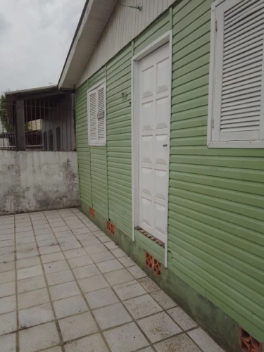 Imagem de Casa mista localizada no bairro Morro Santana com dois dormitórios e demais cômodos e garagem