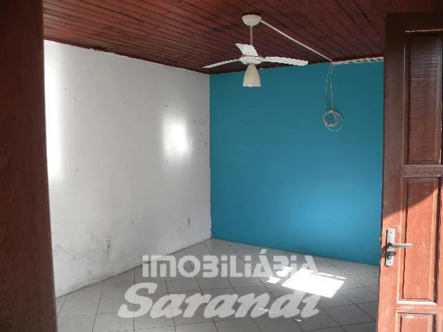 Imagem de Terreno com 2 casas de alvenaria com garagem coberta para 3 carros no bairro Sarandi