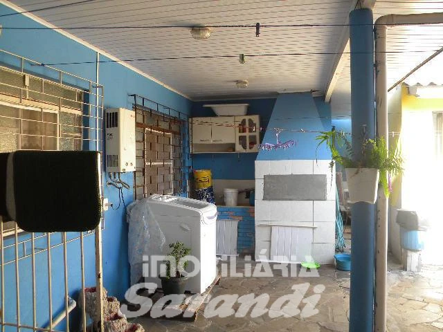 Imagem de Terreno com 2 casas de alvenaria com garagem coberta para 3 carros no bairro Sarandi