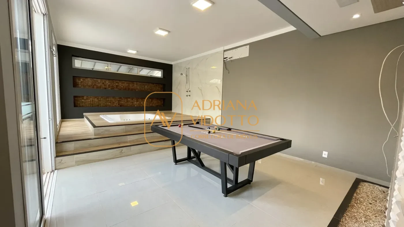 Imagem de IMÓVEL DE ALTO PADRÃO EM CONDOMÍNIO COM 4 SUÍTES, PISCINA, SALA DE JOGOS COM JACUZZI E CINEMA.