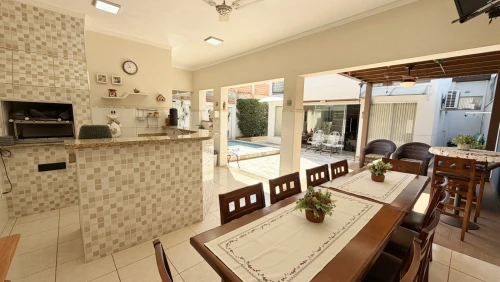 Imagem de IMÓVEL PREMIUM EM CONDOMINIO COM 3 SUÍTES, 3 SALAS, ÁREA GOURMET COM PISCINA AQUECIDA